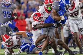 No. 1 Georgia escapes with narrow win at Kentucky