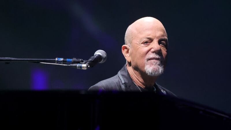 Billy Joel at a piano