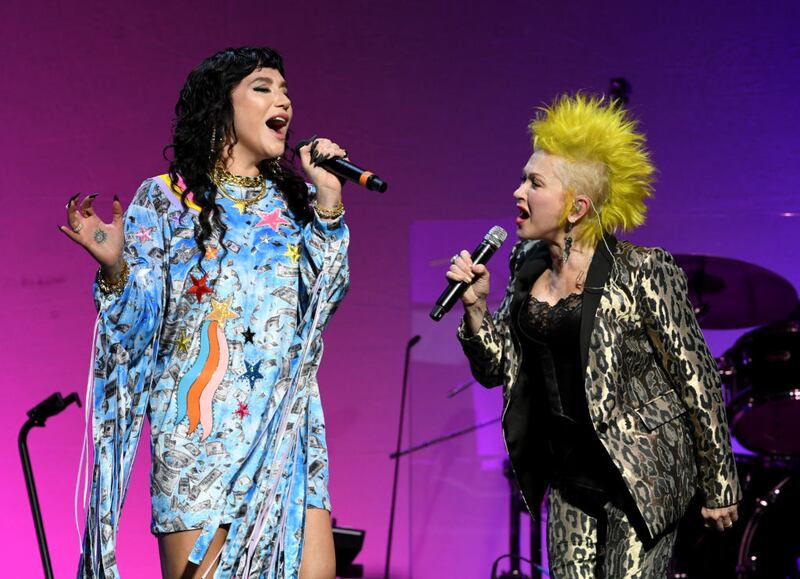 LOS ANGELES, CALIFORNIA - DECEMBER 10: Kesha (L) and Cyndi Lauper perform onstage at the Cyndi Lauper And Friends: Home For The Holidays Benefit at The Novo by Microsoft on December 10, 2019 in Los Angeles, California. (Photo by Kevin Winter/Getty Images)