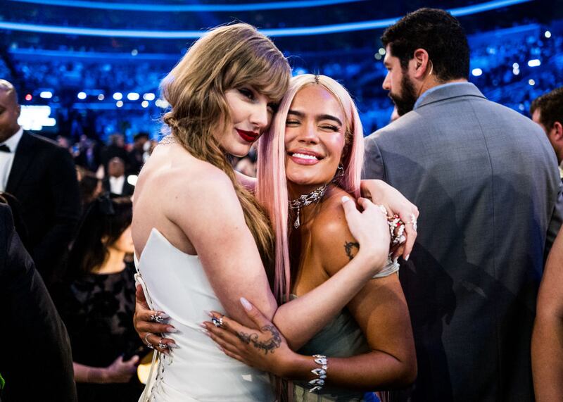 LOS ANGELES, CALIFORNIA - FEBRUARY 04: (L-R) Taylor Swift and Karol G attend the 66th GRAMMY Awards on February 04, 2024 in Los Angeles, California. (Photo by John Shearer/Getty Images for The Recording Academy)