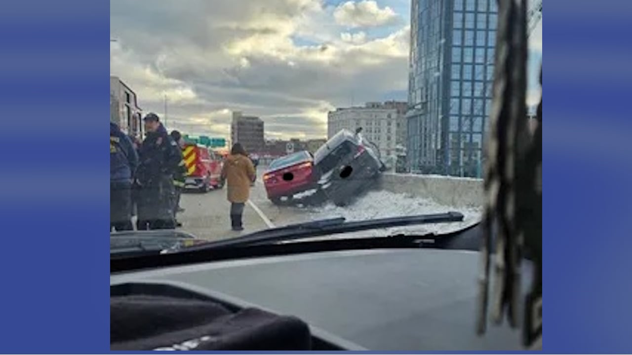 A deputy had to break out the back window of an SUV, right, to allow an FBI agent to crawl to safety after her vehicle was dangling over the edge of an interstate..