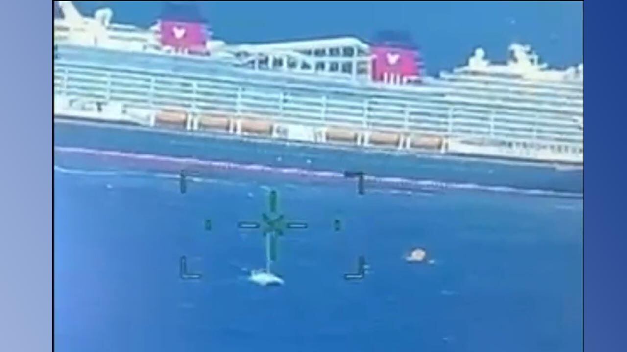 Still frame from Coast Guard video of the Treasure rescuing people from a stranded catamaran.