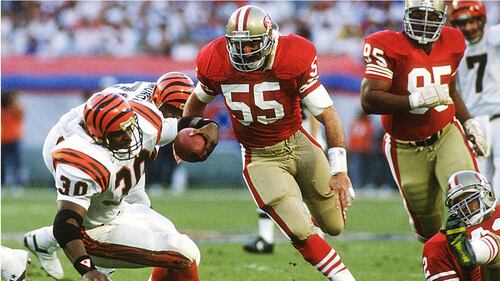 The San Francisco 49ers linebacker (55) closes in on Ickey Woods during Super Bowl XXIV.