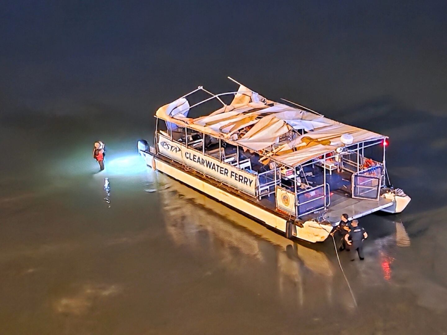 A ferry on a sandbar after a collision.